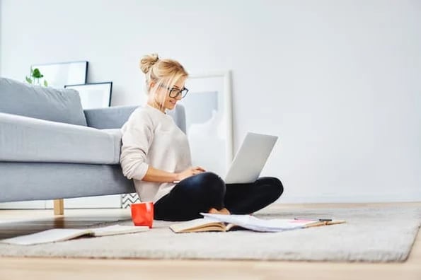 woman on laptop looking at good and bad sales content